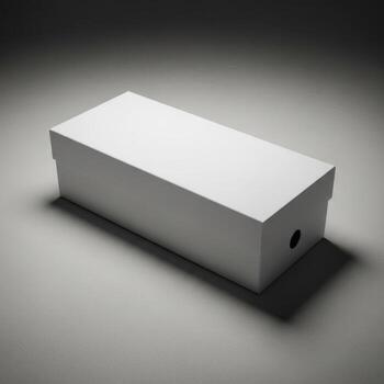 A simple rectangular white shoe box with a small circular hole on the side isolated on white background photo
