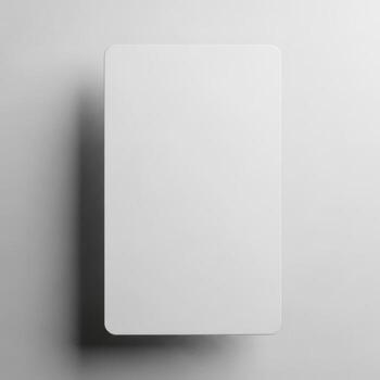 A blank white rectangular card casting a subtle shadow isolated on white background photo