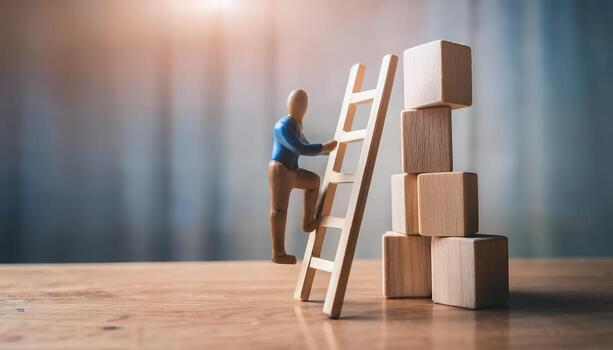 Miniature figure climbing wooden ladder towards stacked blocks. photo