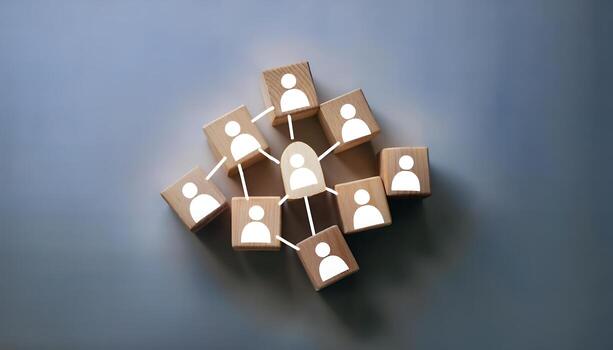 Wooden blocks forming a network, highlighting a central figure. photo