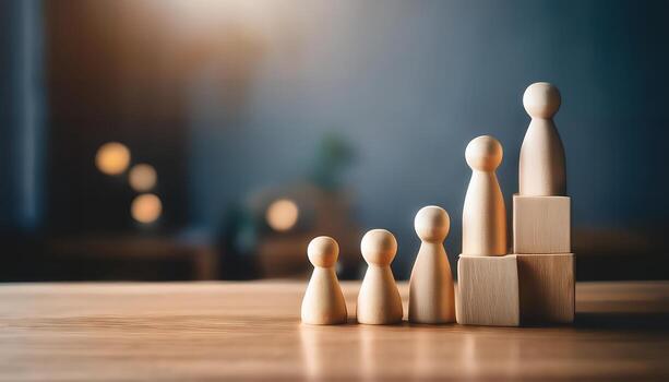 Wooden figures ascending on blocks, symbolizing growth, success, and teamwork. photo