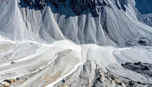 Alpine scree slope patterns from above cool gray tones wallpaper background representing mountain geology detail suitable for natural abstract design photo