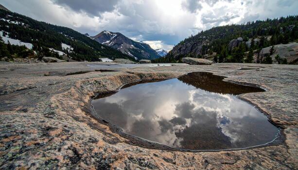 Meltwater sheen on granite slab under overcast gentle speculars representing refined stone texture suitable for clean product and editorial design photo