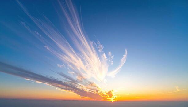 Sundown glow reflecting off thin high cloud smooth gradient wide space representing atmospheric sky scene suitable for serene editorial and branding design photo