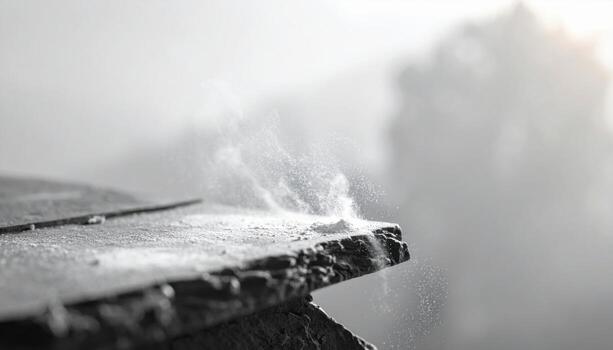 Chalk dust residue on slate ledge with high key haze clean minimal background with copy space to the right for education and quiet design layouts photo
