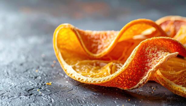 Dehydrated citrus peel curl on plain surface airy light and top copy band clean food background for garnish recipe card cocktail and baking design photo