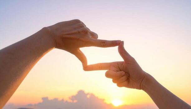 Hands framing a rectangle against pale sky director gesture clean composition with open sky band and generous copy space for banner poster and headline photo