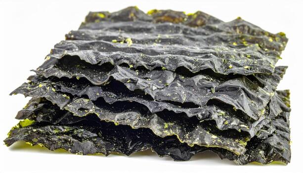 Macro dried kombu strip trimmed edge detail isolated on white clean studio food packshot with copy space for soup base recipe and pantry ecommerce listing photo