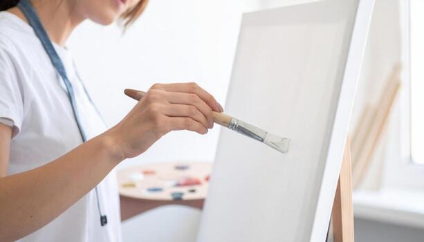 Painter mixing neutral palette on blank board high key wall soft light minimal studio scene with generous copy space for creative background and banner photo