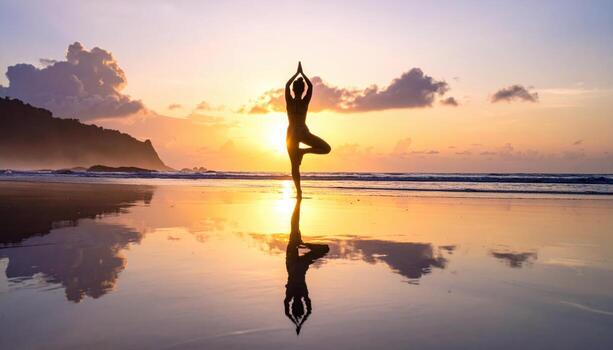 Yoga tree pose silhouette on flat beach at sunrise mirror reflection on wet sand open sky band minimal scene with large copy space for banner and headline photo