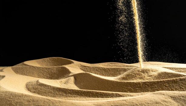 Falling sand captured mid air against matte black with left side empty time lapse feel and clean copy space minimal background photo