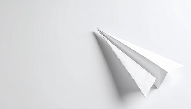 Folded white origami planes with soft shadows minimalist composition and wide left side copy space clean paper background photo