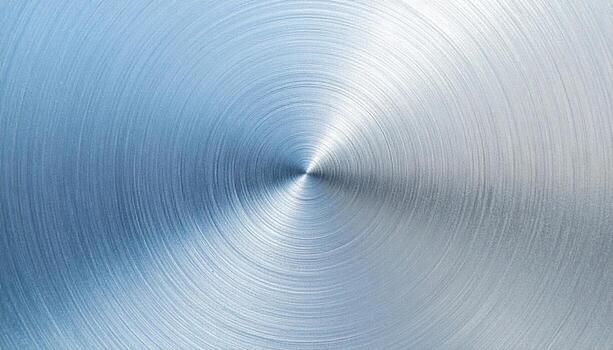 Anodized aluminum subtle color shift from blue to grey smooth finish central copy space representing metal surface suitable for technology product branding and modern design photo