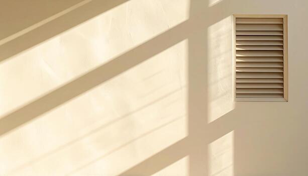 Vent grille shadows forming rectangles on an ivory wall clean geometry right side copy representing interior light pattern suitable for architecture branding and design photo