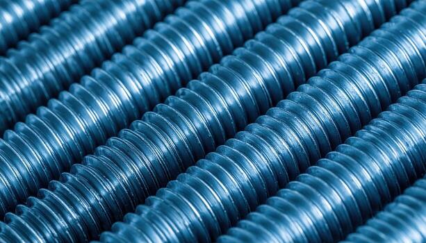 Steel bolt threads with precise helix cool tones and top copy field representing engineering detail suitable for industry product and technology design photo