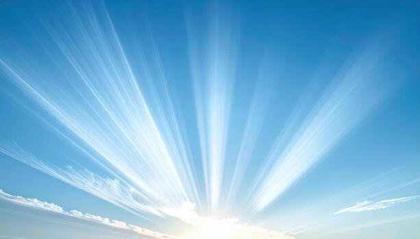 Crepuscular rays fanning through thin cirrus muted blues clean upper copy space representing sky optics suitable for weather education and calm design photo