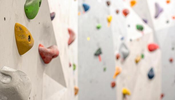 Climbing wall resin texture out of focus neutral greys wide copy area representing sport surface suitable for fitness branding and background design photo