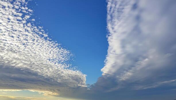 Mackerel sky altocumulus confined to top edge airy blue field below large copy space representing sky pattern suitable for weather education travel and design photo