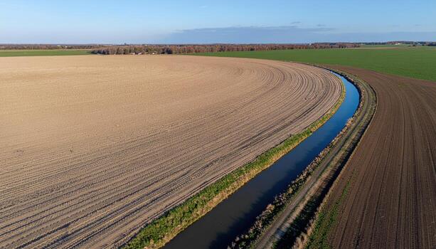 Center pivot irrigation tracks curving across a dry field aerial feel right side copy space representing agriculture pattern suitable for mapping editorial and design photo