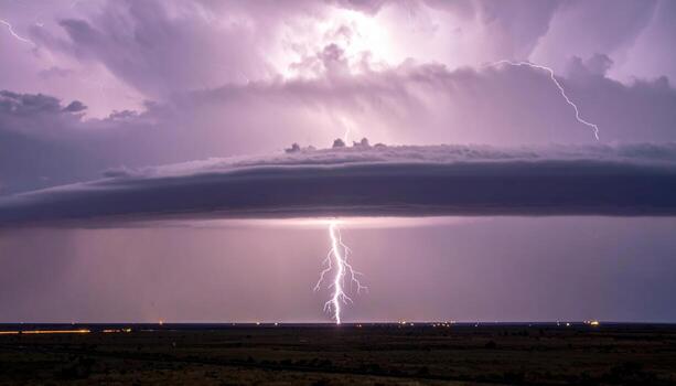 Ridge lightning crawler skimming cloud base epic shadowed plain representing distant thunderstorm dynamics and grand landscape scale suitable for science education weather features photo