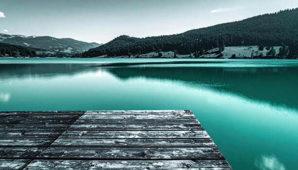 Lake thermocline shimmer from pier minimal waves cool teal tone representing freshwater stratification and elegant surface patterns suitable for science features travel guides and clean design photo