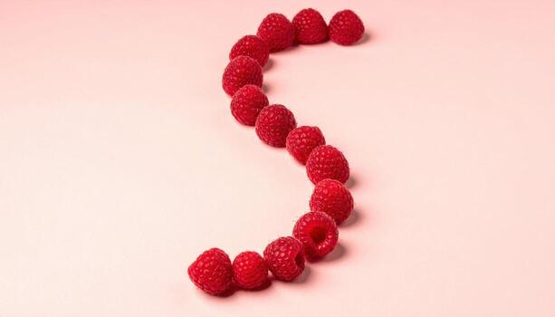 Studio photo of raspberries arranged in a gentle serpentine curve on matte rose ground, subtle top glow and airy negative field.
