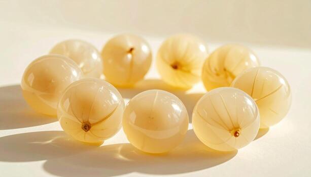 Ackee arils isolated as abstract pearls on soft cream board with feathered shadows professional food photograph for editorial education botany and minimalist design applications photo