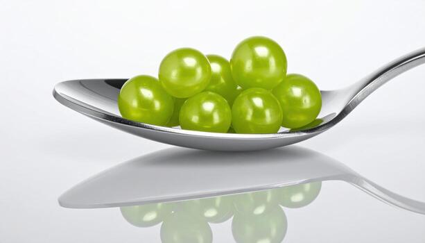 Finger lime pearls nested in a shallow spoon river on chrome with crisp specular streaks modern citrus macro for editorial beverage menus and premium design backgrounds photo