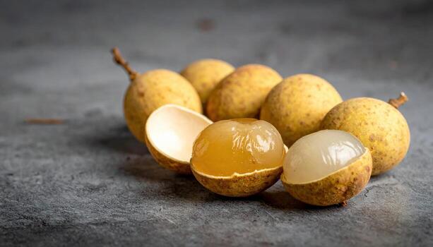 Longan shells halved and nested into a gentle curve on neutral stone refined tropical still life for editorial education culinary and minimalist layouts photo