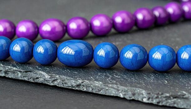 Jostaberry beads marching in two rows on graphite board satin finish and shallow depth refined hybrid berry still life for editorial and clean design photo