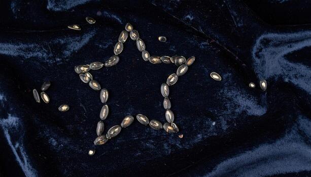 Watermelon seeds aligned into a constellation pattern on charcoal velvet refined dark minimal still life for editorial menus typography and sleek branding photo