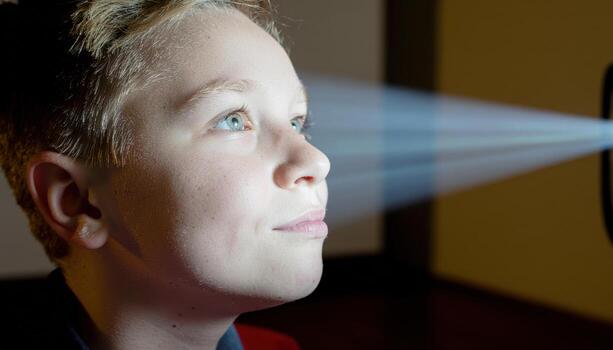 Young child with bright inspiration lips parting projector dust beam trailing behind soft studio portrait for learning discovery creativity education and brand storytelling photo