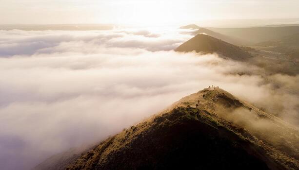 Fictional soldiers advancing through dawn ground fog on a ridge line soft rim light long negative space cinematic field scene for training security and defense themes photo