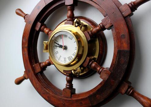 Pointer Clock With Copper Frame In A Center Of Wooden Helm Angle View photo