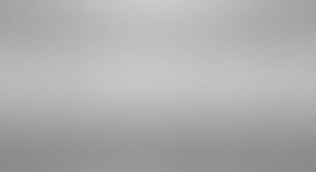 A subtly textured silver background showcases a smooth gradient from light to dark, creating a versatile surface for various design applications and overlays. photo