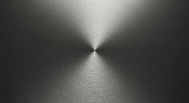 The circular brushed metal texture reflects a central light source, creating a modern and industrial aesthetic with subtle gradients in shades of gray and silver. photo