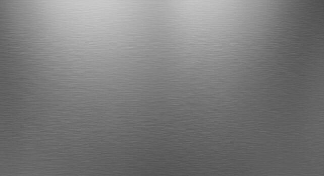 Smooth gray metal surface with subtle brushed texture and soft overhead lighting creating a minimalist industrial background for design and product presentations. photo