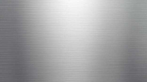 Silver metallic surface displays an illuminated gradient effect, creating a brushed metal appearance ideal for industrial designs and modern backgrounds textures. photo