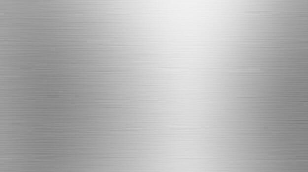Light reflects across a silver metal surface showing a brushed texture with a subtle gradient from light to dark, creating a modern and industrial aesthetic. photo