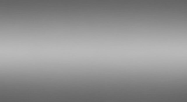 The brushed metal texture presents a gradient of light to dark gray, providing a versatile background for graphic designs and product mockups with sophistication. photo