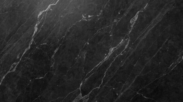 An elegant dark grey marble stone with flowing white veins showcases a natural, timeless pattern ideal for luxury surface design and sophisticated backgrounds. photo