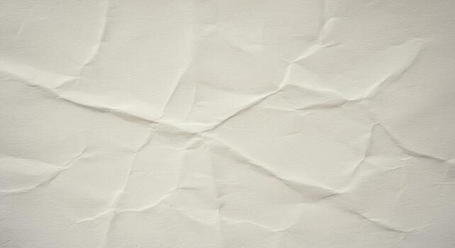 An old piece of paper shows its distressed surface with a multitude of creases and folds, creating an abstract, textured pattern with varying shadows and highlights. photo