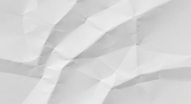 White crumpled paper displays an abstract pattern of jagged folds, creating a textured surface for versatile backgrounds and artistic presentations usefully. photo