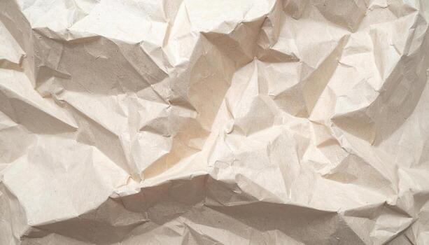 A close-up photograph showcases the complex textures and patterns of a heavily crumpled sheet of off-white paper, perfect for a textured abstract background effect. photo