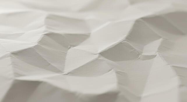 The softly focused and textured surface of a white crumpled paper background creates a subtle, elegant, and visually interesting abstract pattern for designs. photo