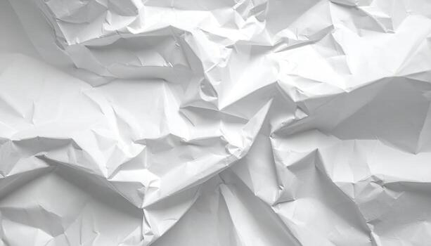 The abstract patterns of light and shadow define a textured background of crumpled white paper, creating an interesting visual for design or photography uses. photo