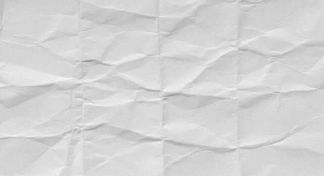 The textured surface of the crumpled white paper creates an abstract design that evokes feelings of fragility and impermanence in its simple elegance. photo