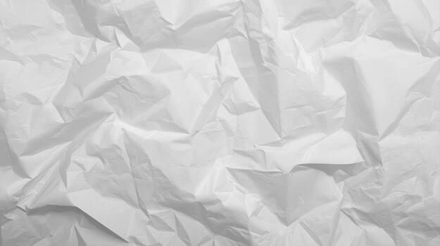 A textured white paper background displays a crumpled and wrinkled surface, creating a dynamic pattern of light and shadow across the frame for design elements. photo