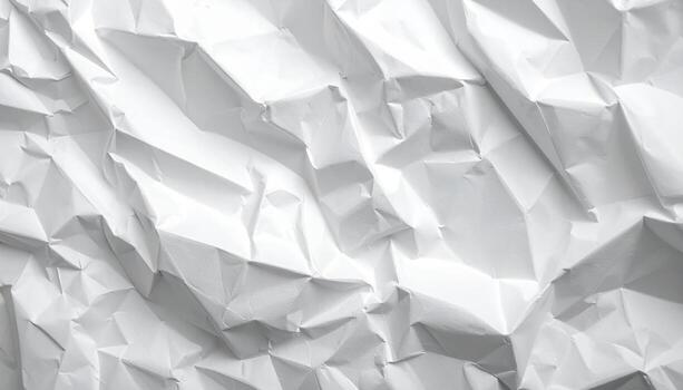 White crumpled paper surface reveals an abstract pattern of shadows and highlights, creating a textured and dynamic background for graphic design elements. photo