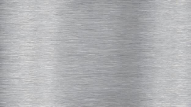 Horizontal light reflects across brushed silver metal surface creating subtle linear texture and gradient tones. photo